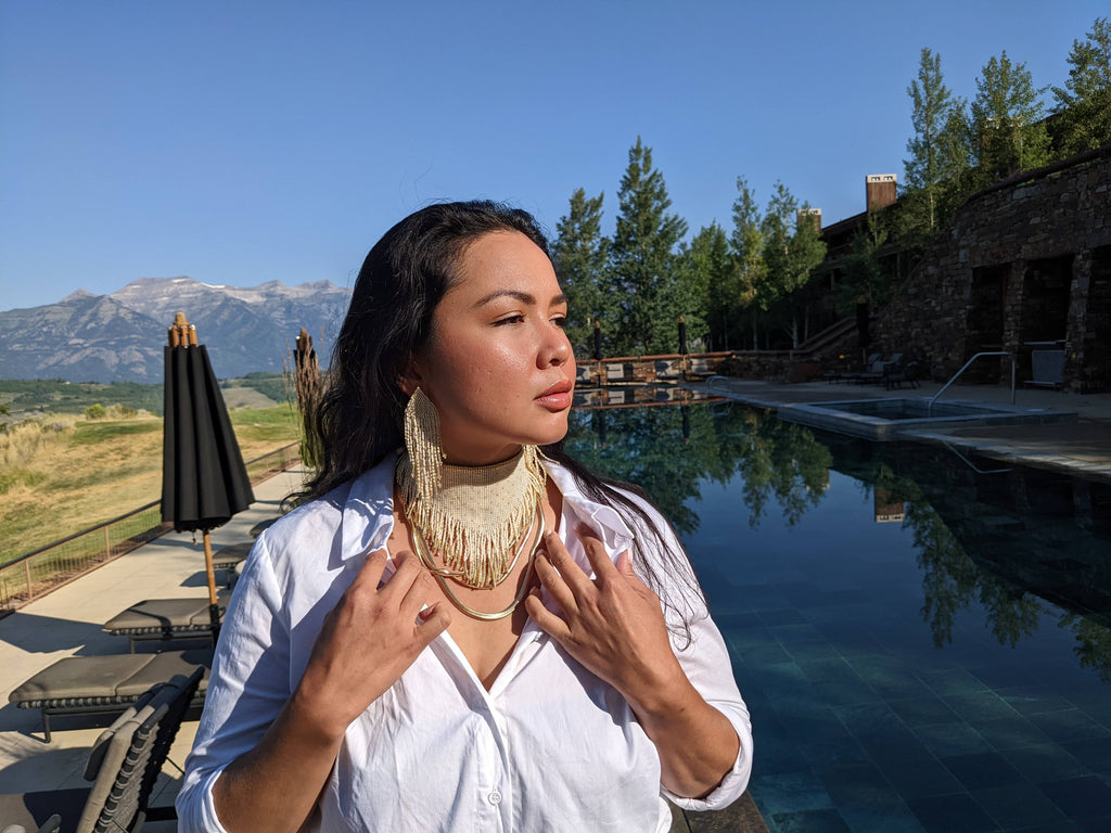 woman wearing cream ring beaded bandana