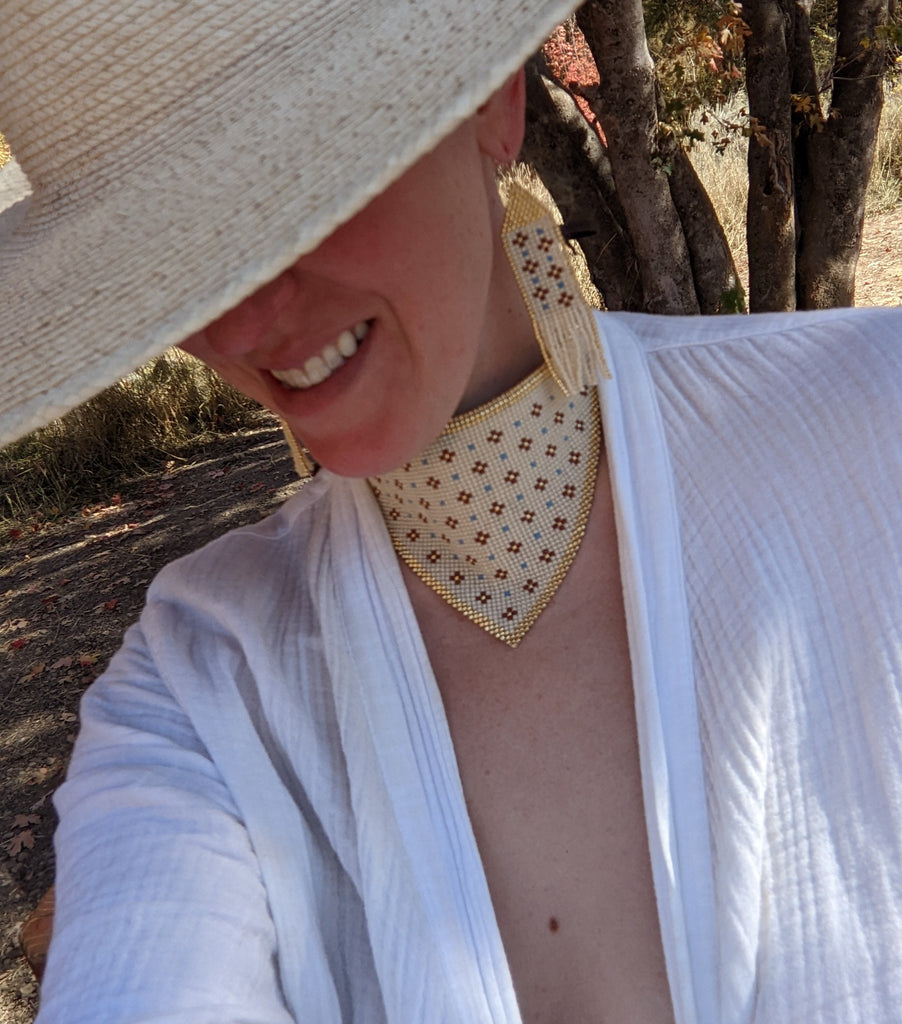 Cream bandana with gold border, punctuated with terra Cotta &amp; gold flowers and blue dots.